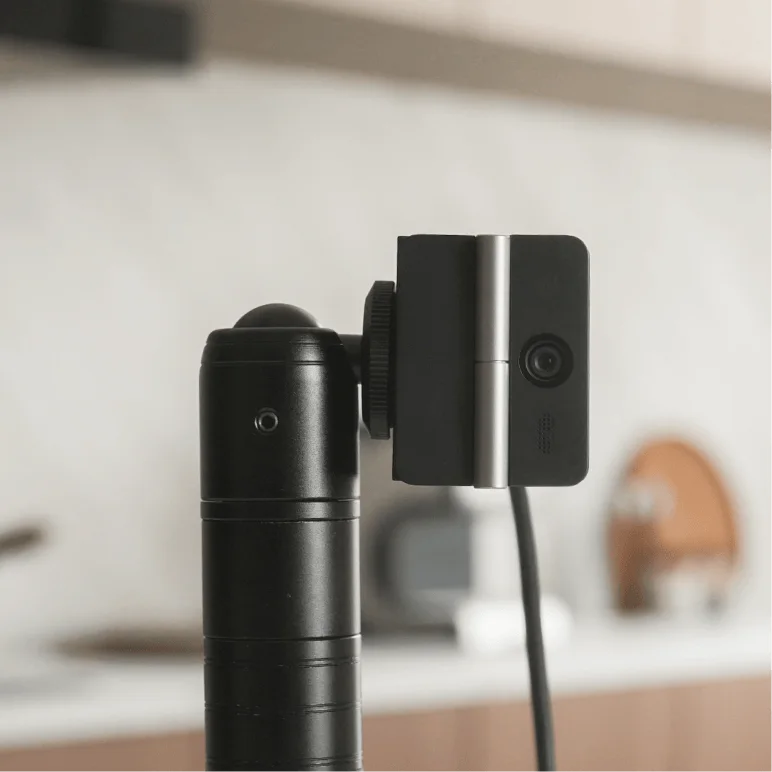 Side and rear mounting view with a separate support and connected cable.