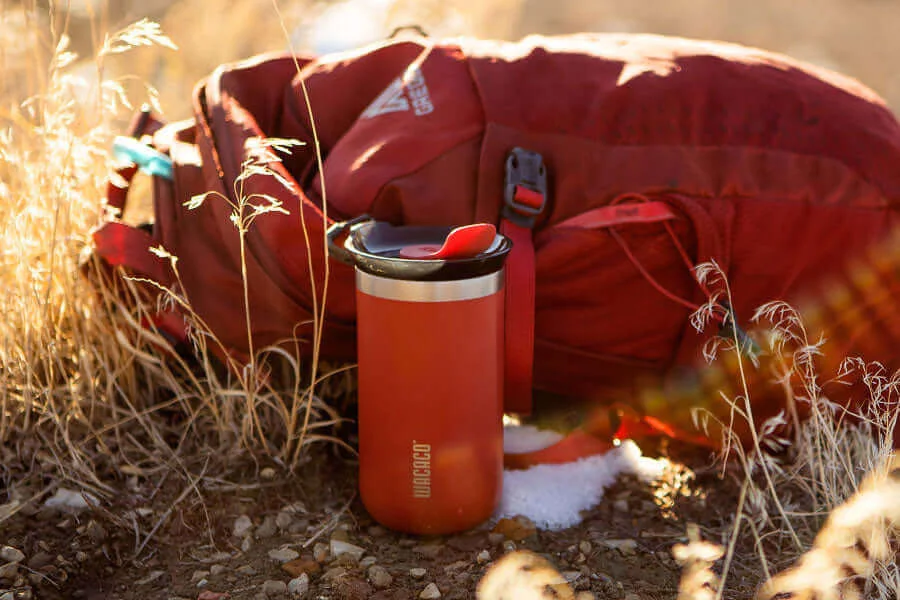 mug beside backpack not included