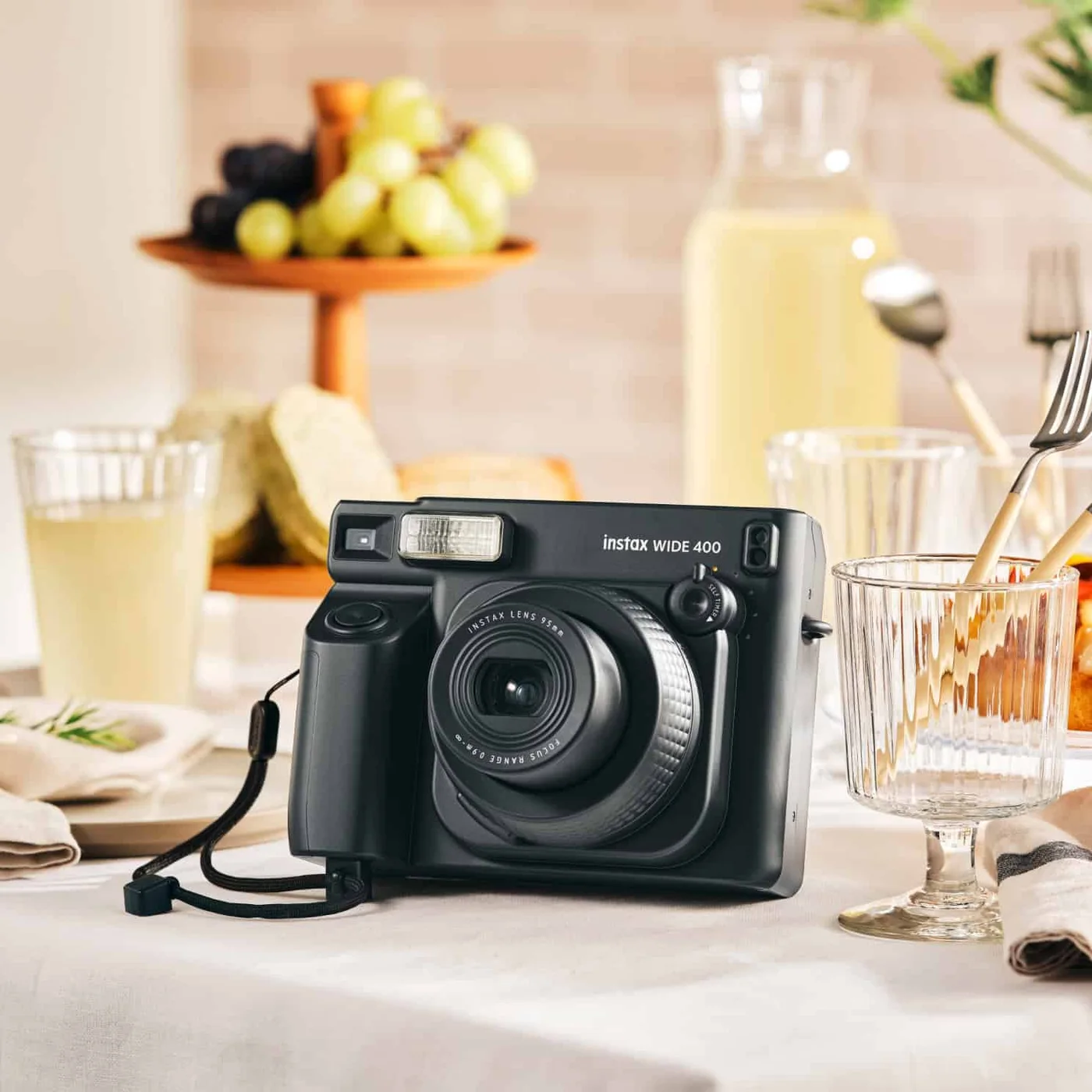 INSTAX WIDE 400 Instant Camera Sage Green — manufacturer gallery view 10 — alternate colour shown to illustrate shared controls and use; the selected listing is Sage Green.