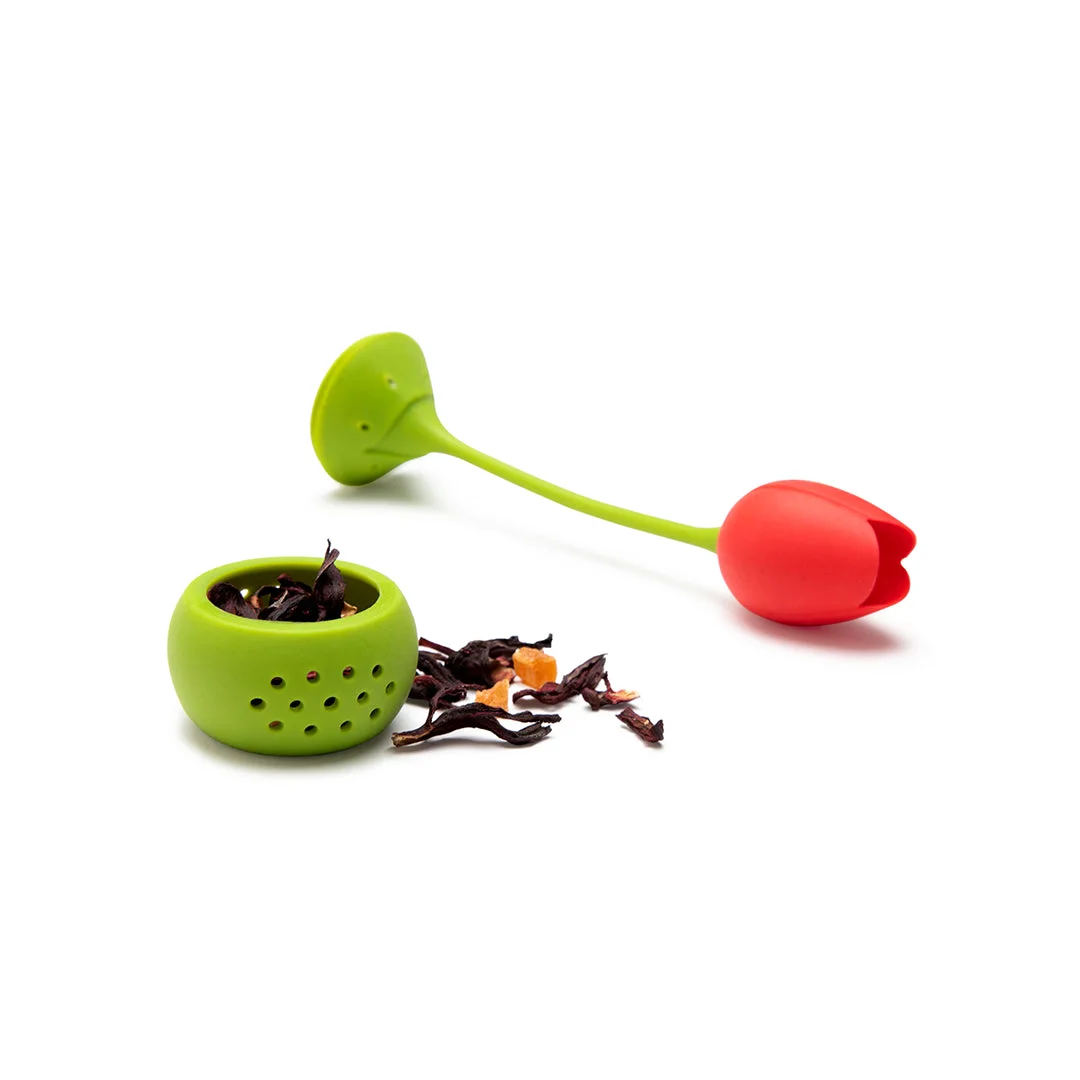 opened red infuser with tea leaves