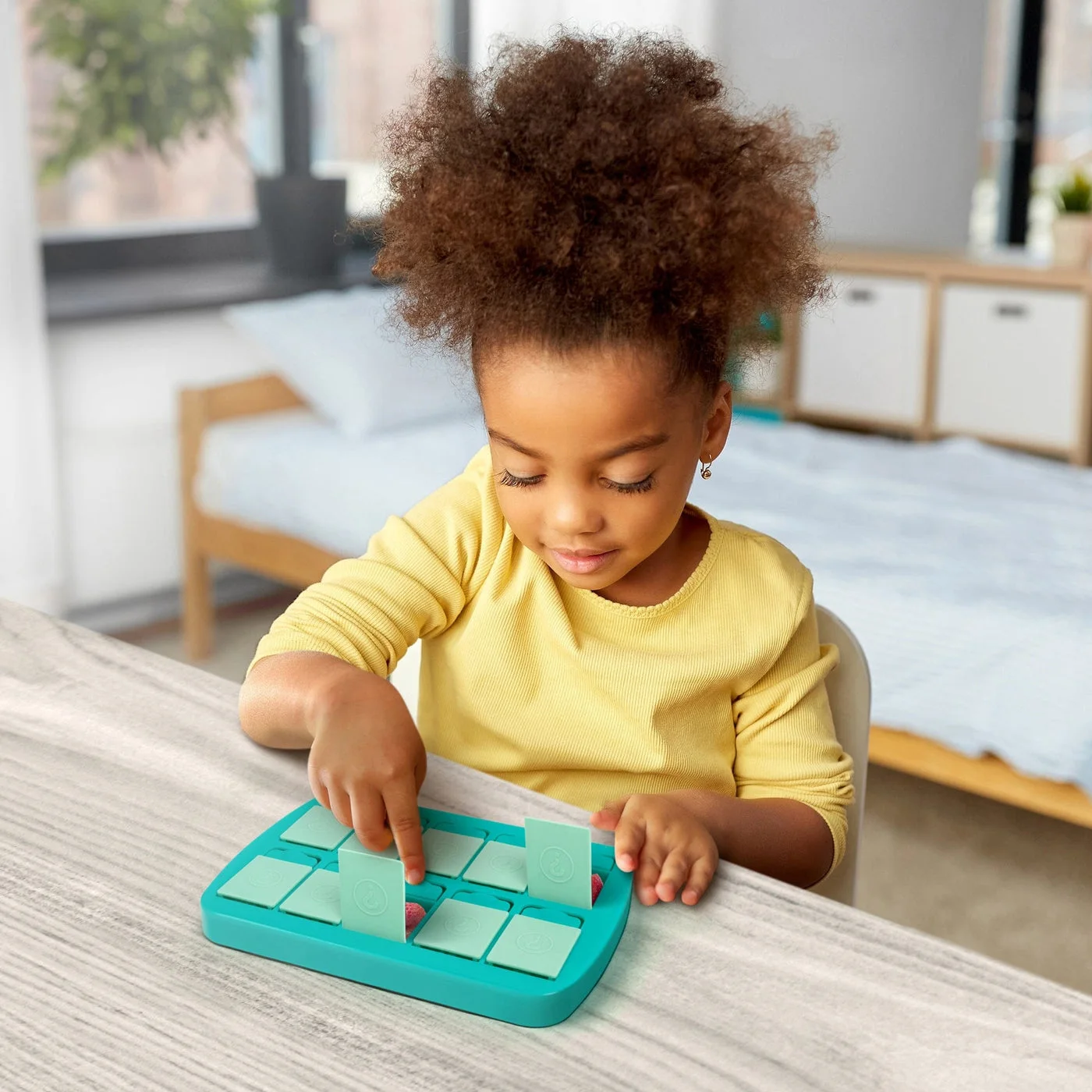 child demonstration at table, not independent test