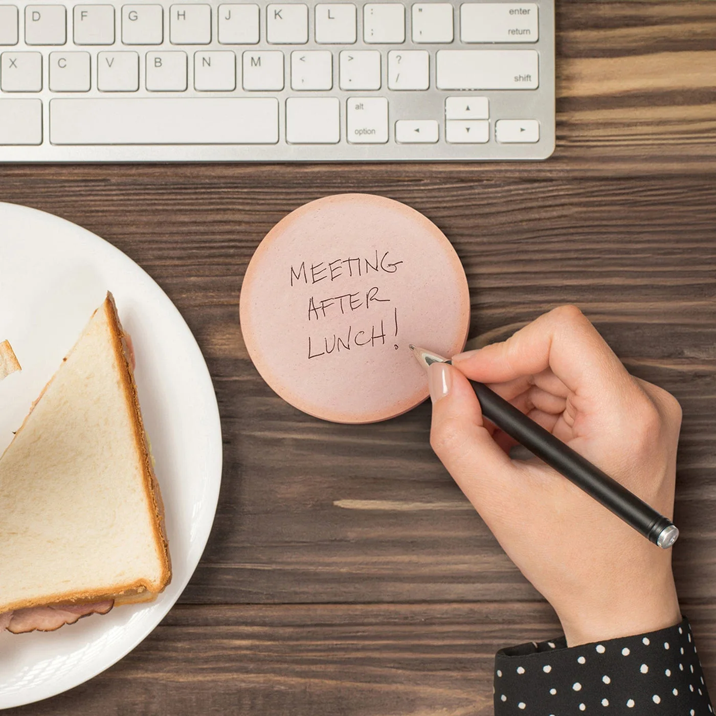 writing demonstration; keyboard, pen and sandwich not included