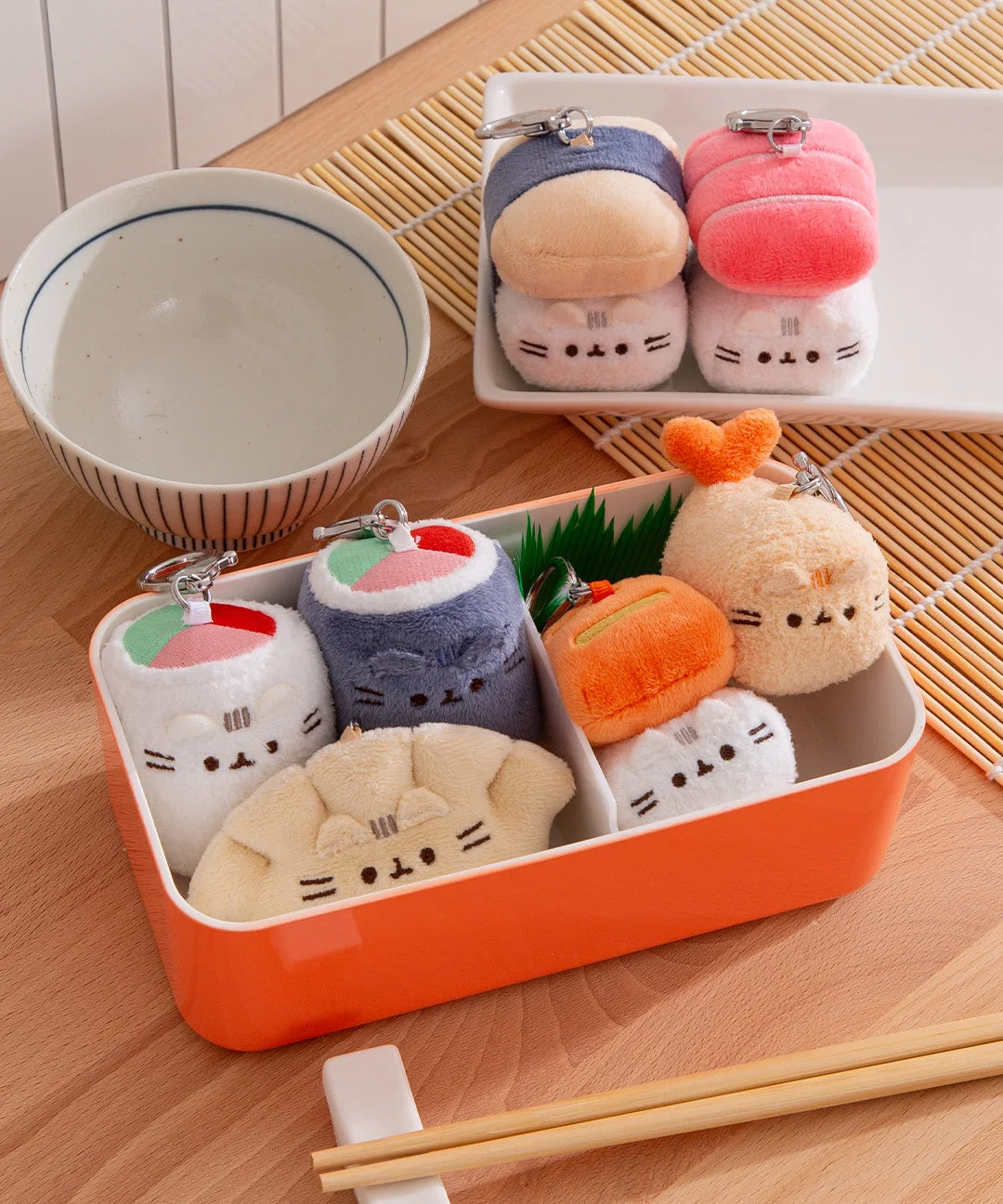 multiple Bento characters in lunchboxes; one random plush supplied
